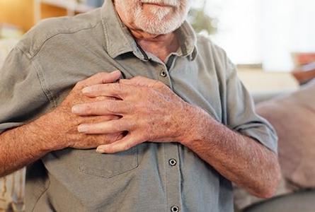 Man with his hand over his heart